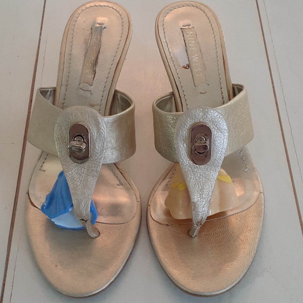^ Metallic gold Nine West heeled thong sandals